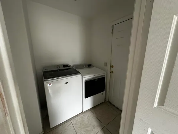 a utility room with washer and dryer