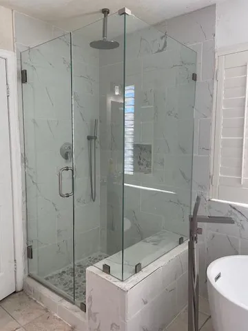 a bathroom with a shower and toilet