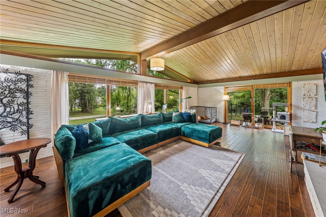 3381 Barrett Road Akron, OH 44333 - Photo 6 of 50 Living room featuring dark wood-type flooring, plenty of natural light, and wood ceiling