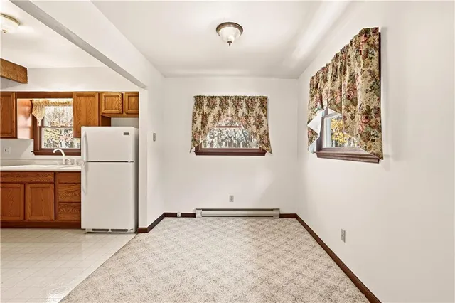 a kitchen with a refrigerator a sink and dishwasher