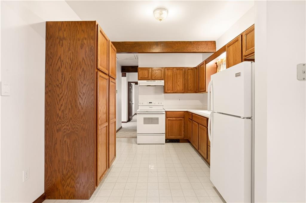 112 Chestnut Ridge Road Acme, PA 15610 - Photo 15 of 31 a kitchen with a refrigerator a sink and dishwasher