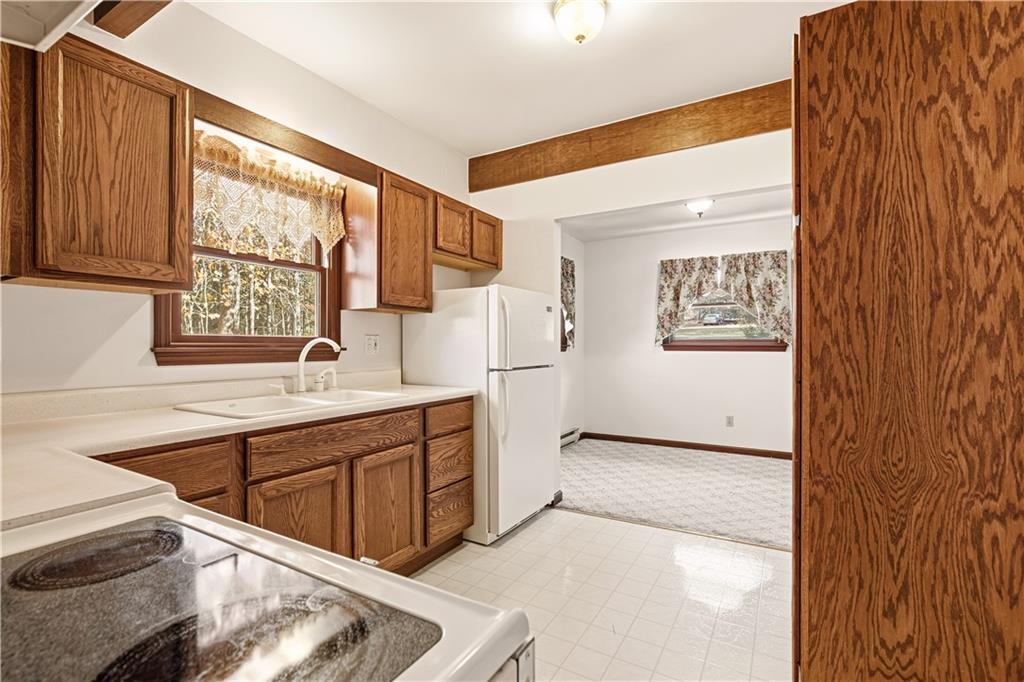 112 Chestnut Ridge Road Acme, PA 15610 - Photo 16 of 31 a kitchen with white cabinets and window