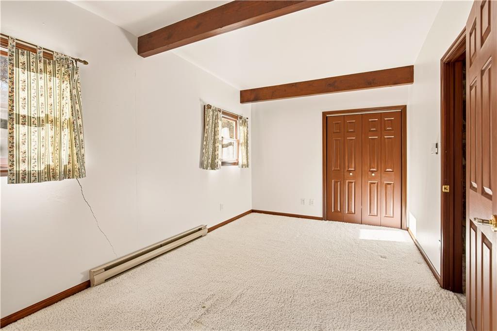 112 Chestnut Ridge Road Acme, PA 15610 - Photo 18 of 31 a view of an empty room with a window