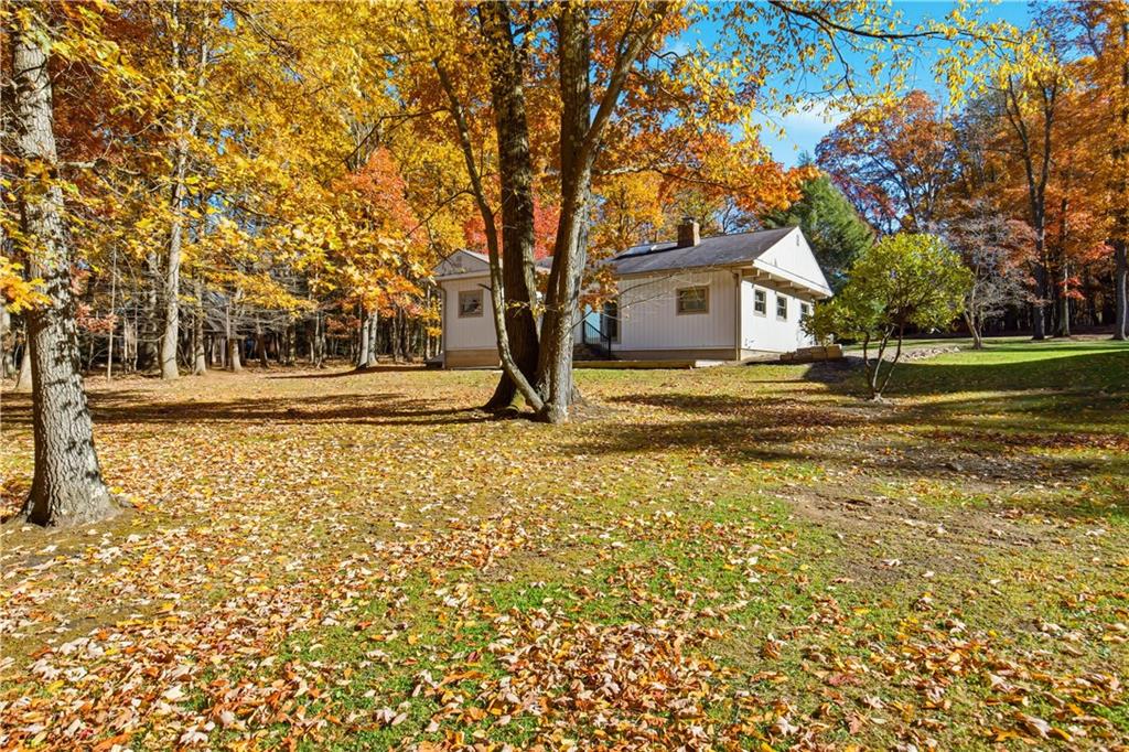 112 Chestnut Ridge Road Acme, PA 15610 - Photo 28 of 31 a house that has a tree in front of it
