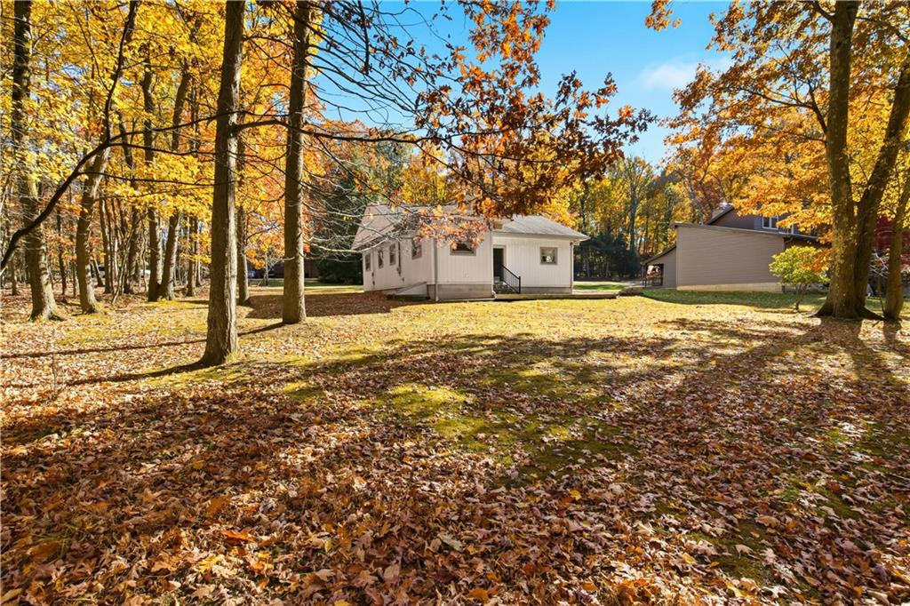 112 Chestnut Ridge Road Acme, PA 15610 - Photo 30 of 31 a view of a house with a yard