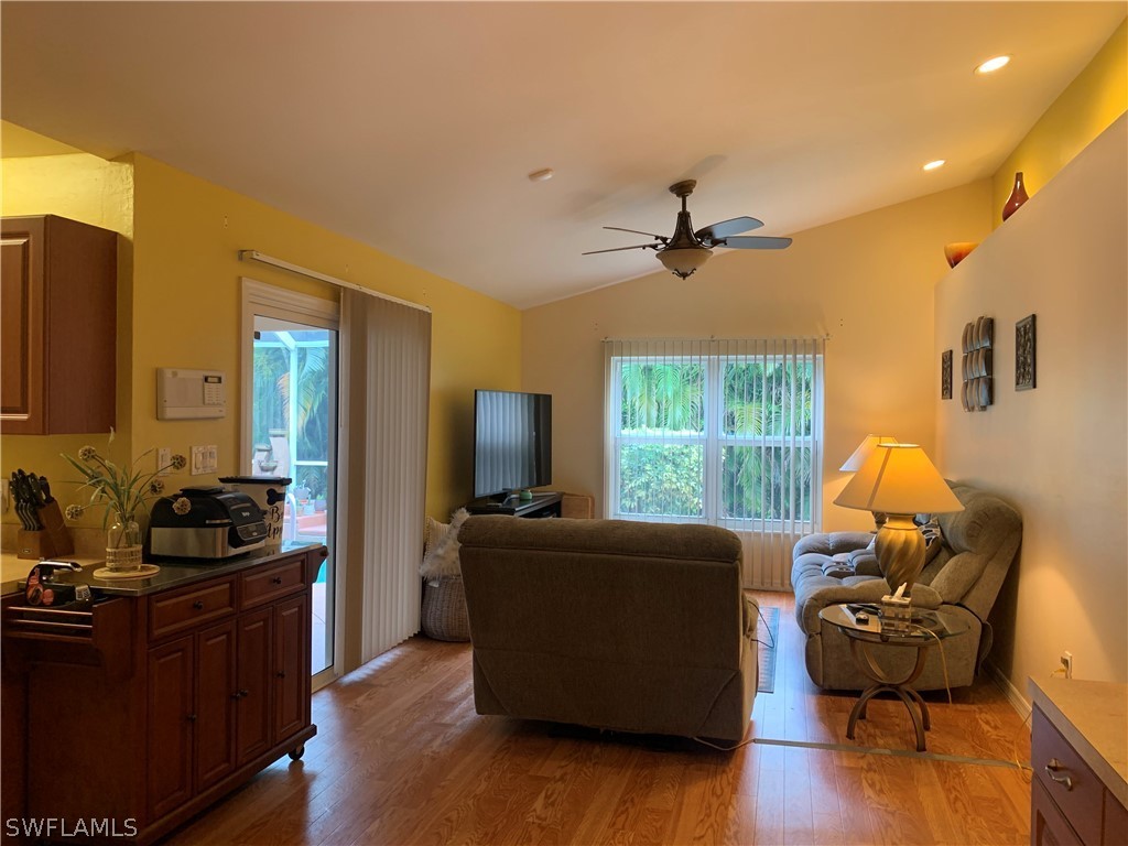 17560 Lee Road Fort Myers, FL 33967 - Photo 15 of 34 a living room with furniture and a flat screen tv