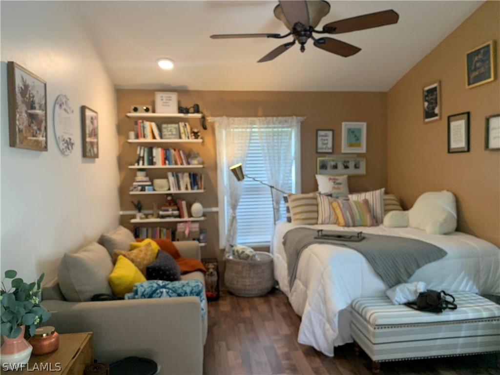 17560 Lee Road Fort Myers, FL 33967 - Photo 25 of 34 a living room with furniture and a book shelf