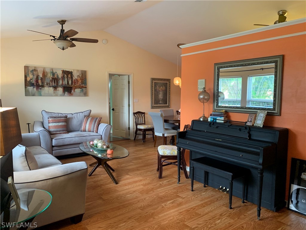 17560 Lee Road Fort Myers, FL 33967 - Photo 4 of 34 a living room with furniture and a piano