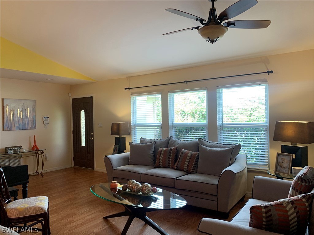 17560 Lee Road Fort Myers, FL 33967 - Photo 5 of 34 a living room with furniture a window and a flat screen tv