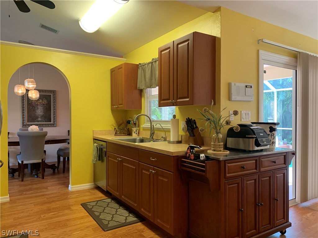 17560 Lee Road Fort Myers, FL 33967 - Photo 8 of 34 a kitchen with a sink and cabinets