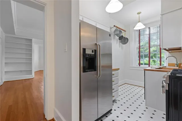 a kitchen with stainless steel appliances a refrigerator and a sink