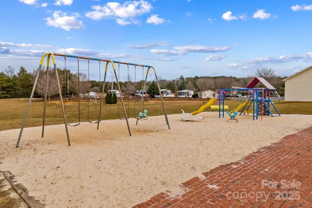 an aerial view of a house with swimming pool and sitting area