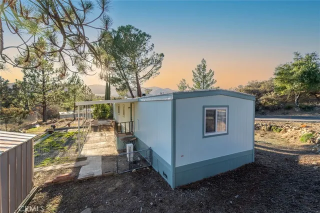 a view of a house with a tree