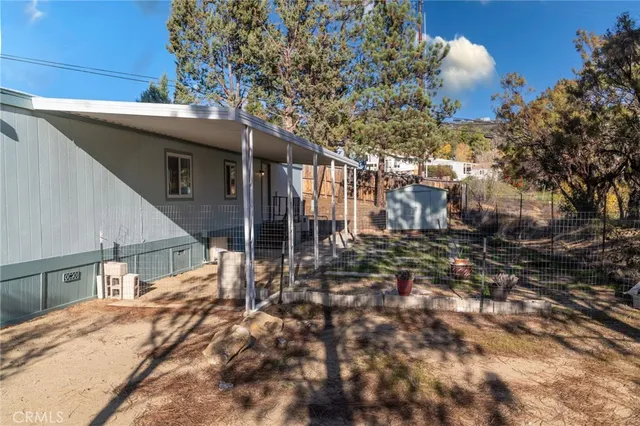 a view of a room with wooden floor and roof
