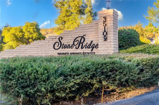 a view of outdoor space with signage and flags
