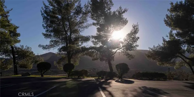 a view of a street with a yard