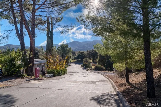 a view of a road with a building in the background