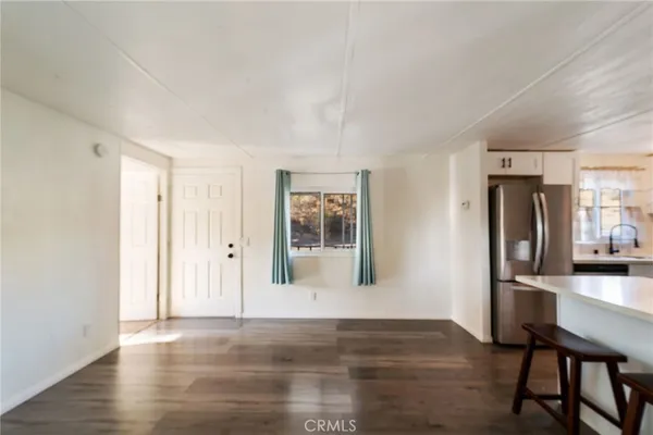 a view of a livingroom with furniture and wooden floor