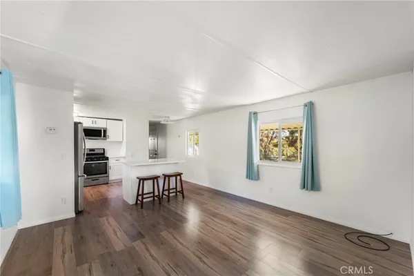 a kitchen with stainless steel appliances a refrigerator and a stove