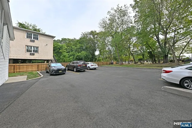 a view of street with parked cars