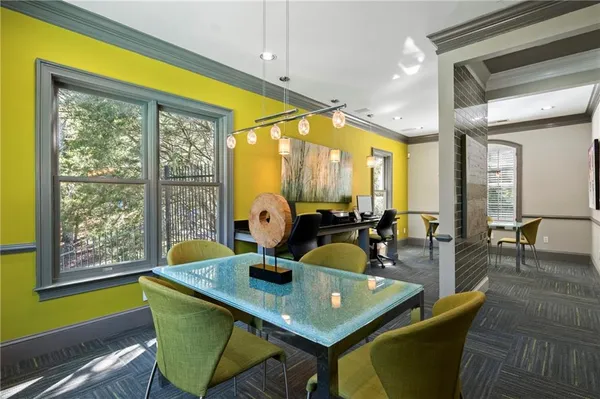 a view of a dining room with furniture and window