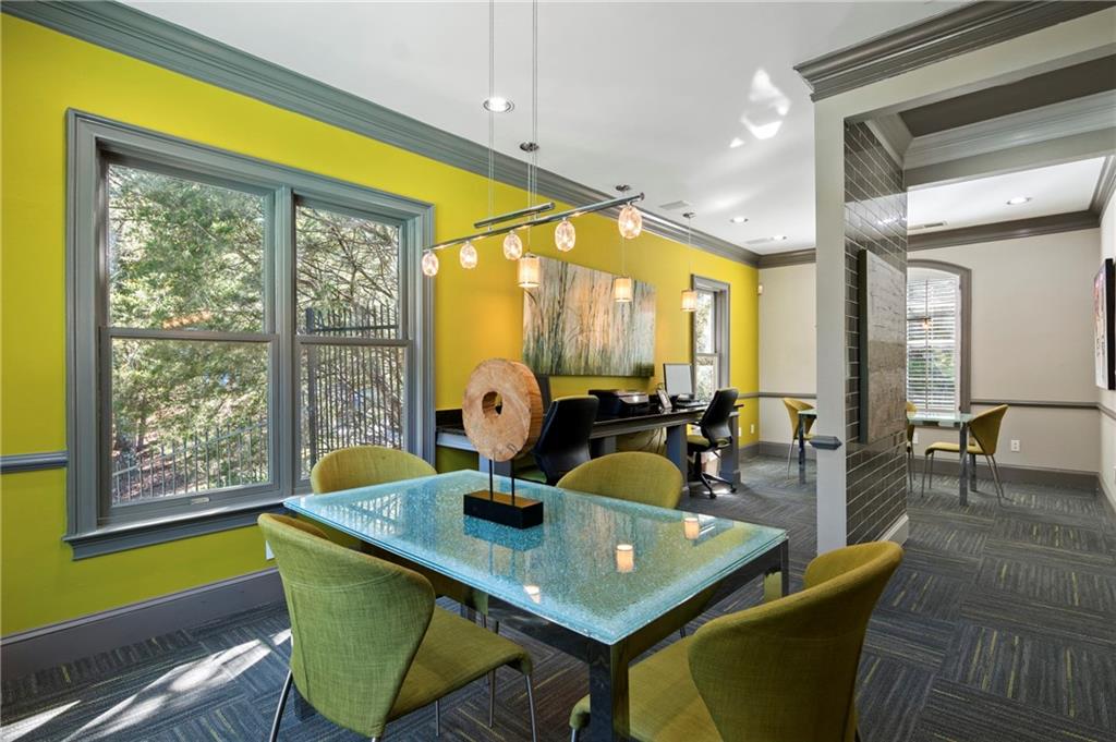 10055 Jones Bridge Road, Unit 206 Johns Creek, GA 30022 - Photo 24 of 28 a view of a dining room with furniture and window