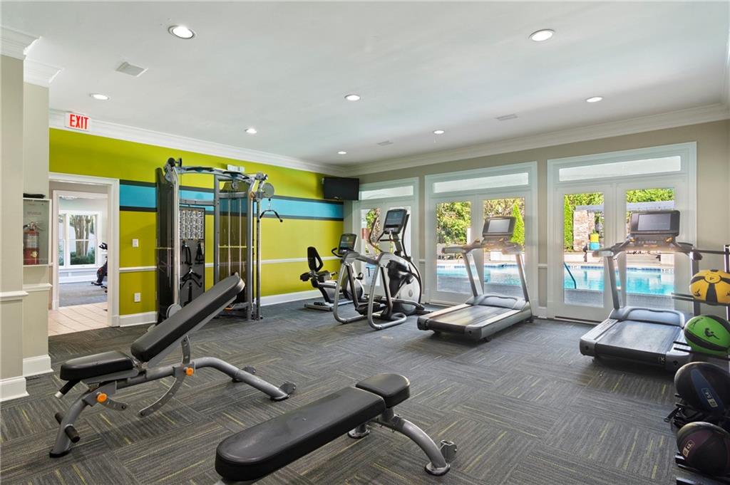 10055 Jones Bridge Road, Unit 206 Johns Creek, GA 30022 - Photo 26 of 28 a view of a room with gym equipment