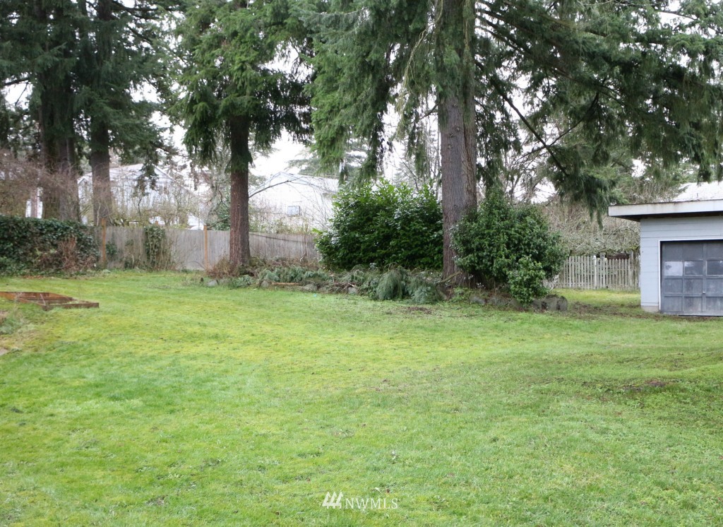 24015 4th Place West Bothell, WA 98021 - Photo 14 of 14 a view of a backyard with large trees