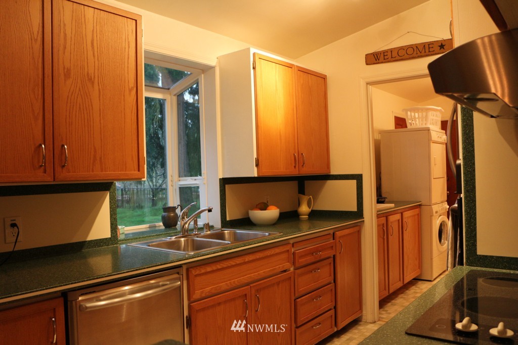 24015 4th Place West Bothell, WA 98021 - Photo 5 of 14 a kitchen with a sink and a refrigerator