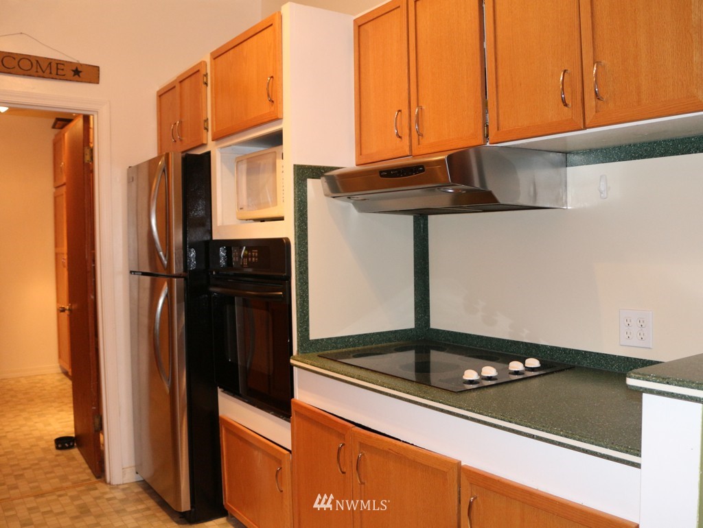 24015 4th Place West Bothell, WA 98021 - Photo 6 of 14 a kitchen with stainless steel appliances granite countertop a refrigerator and a stove