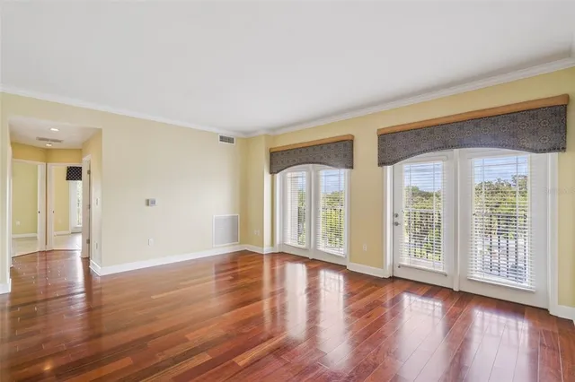 a view of a kitchen with wooden floor and a kitchen