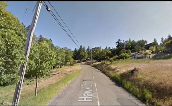 a view of a swimming pool with a yard
