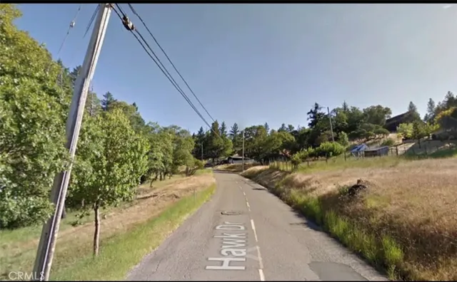 a view of a swimming pool with a yard
