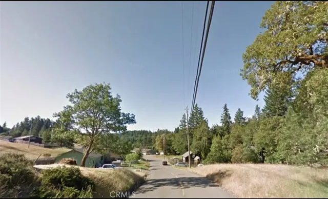 a view of a lake with a yard