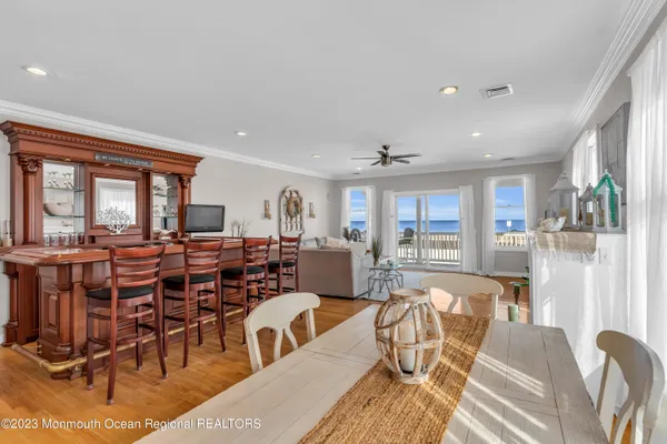 a living room with lots of furniture and a large window