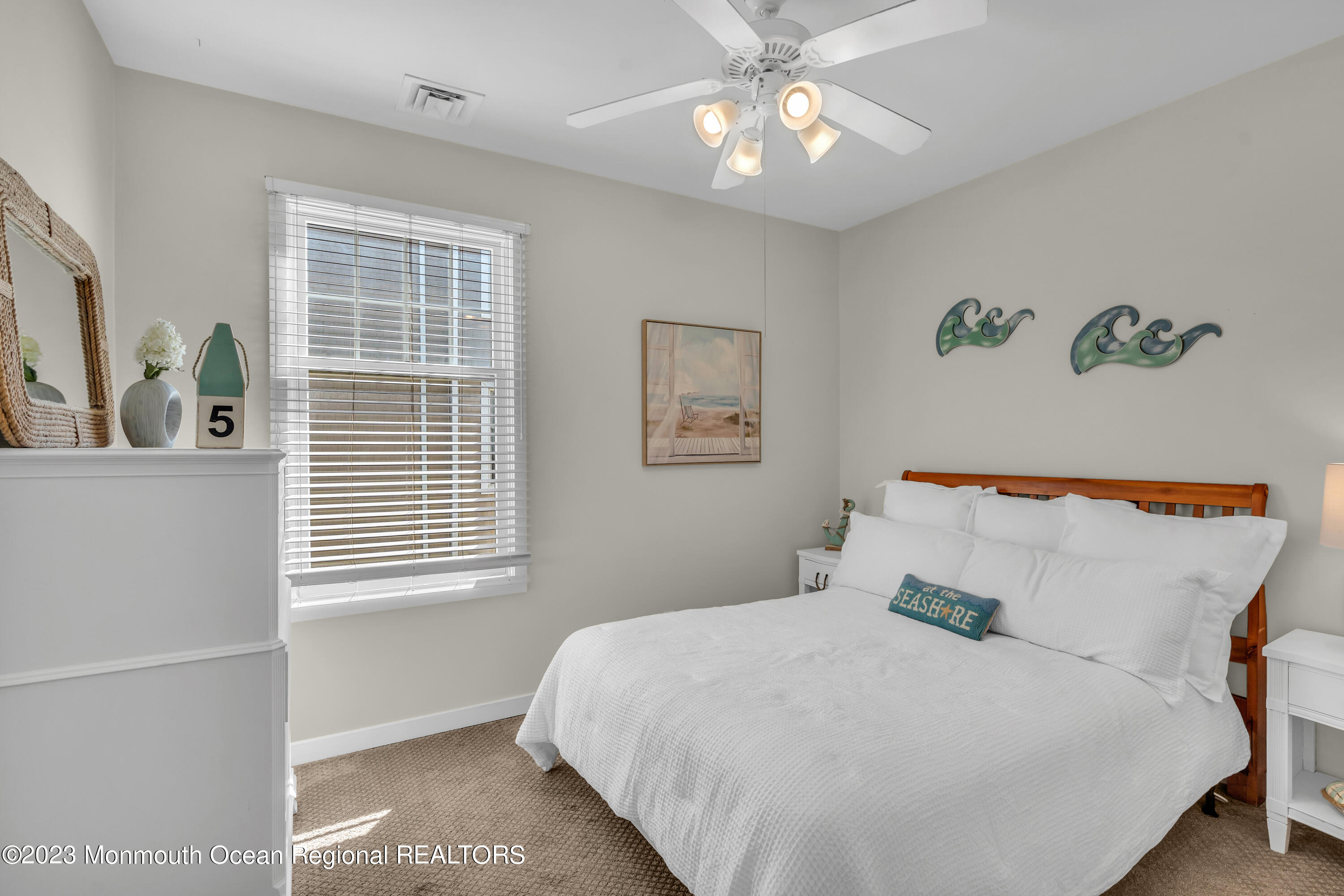 239 Beach Front, Unit 1 Manasquan, NJ 08736 - Photo 22 of 31 a bedroom with a large bed and a window