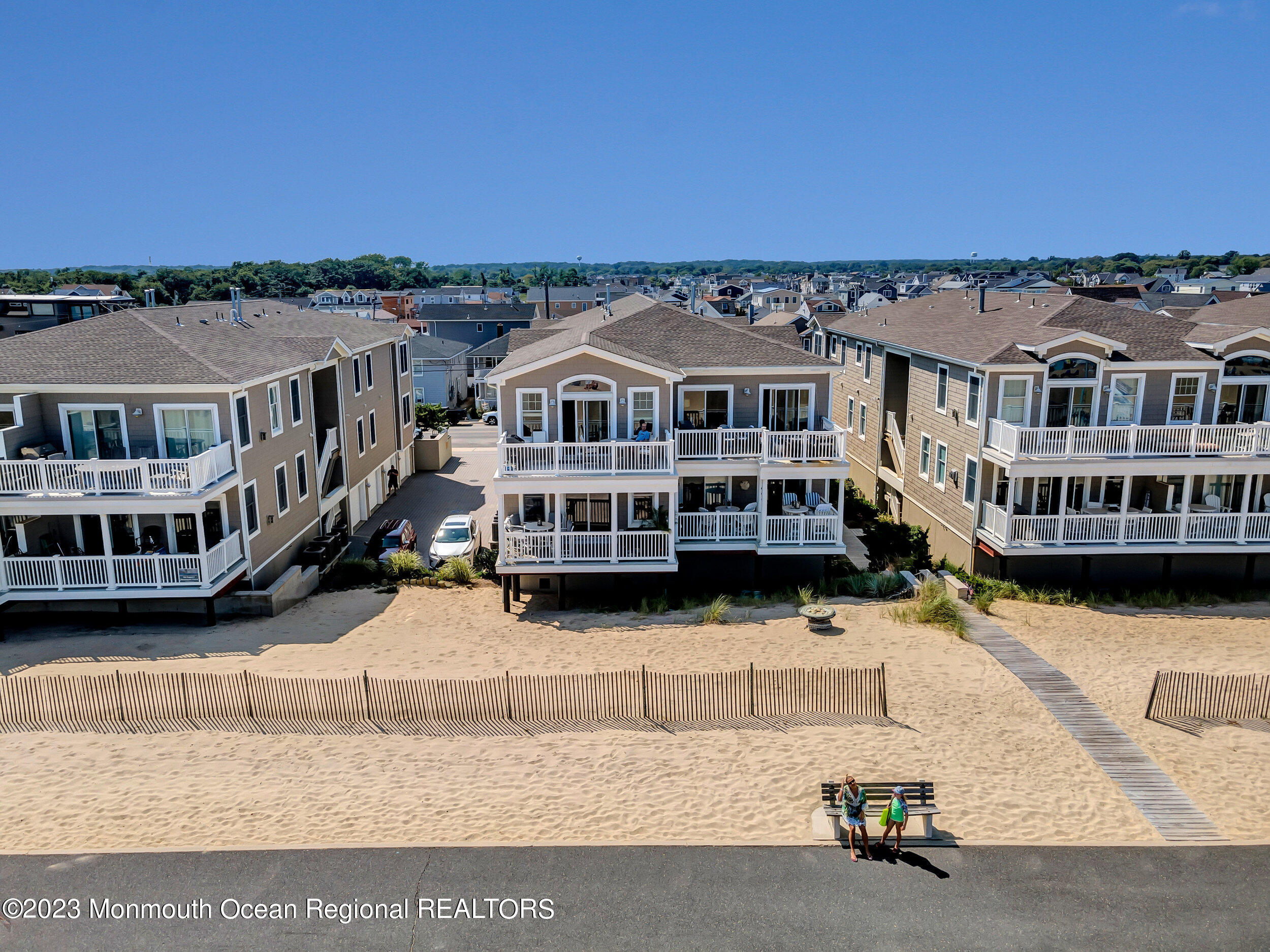 239 Beach Front, Unit 1 Manasquan, NJ 08736 - Photo 25 of 31 a view of a white building with a city view