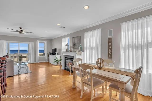 a dining room with furniture and wooden floor
