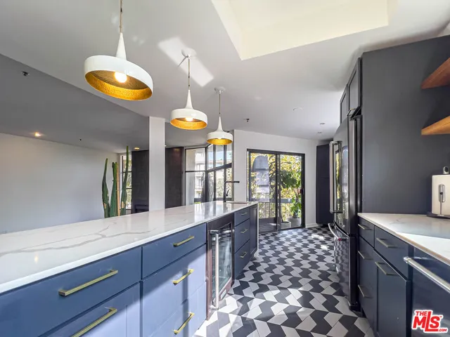 a kitchen with a cabinets and stainless steel appliances