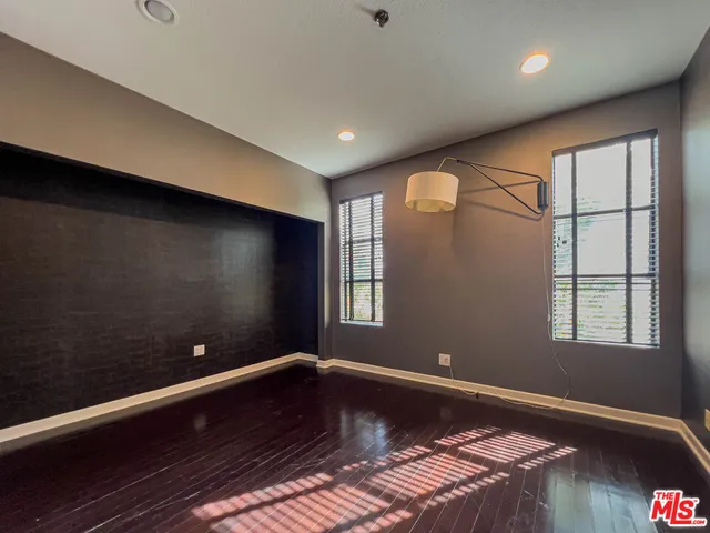 a bathroom with a sink mirror and toilet