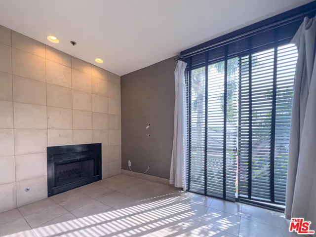 a bathroom with a shower and a sink