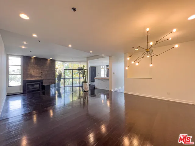 a view of a living room and hardwood floor