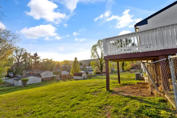 a view of a swimming pool with an outdoor seating