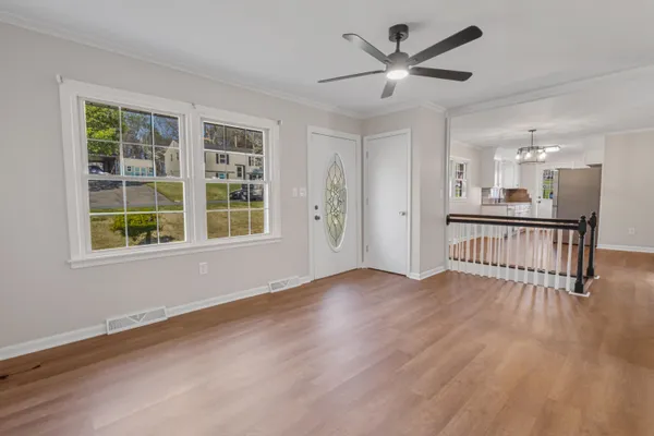 wooden floor in an empty room with a window