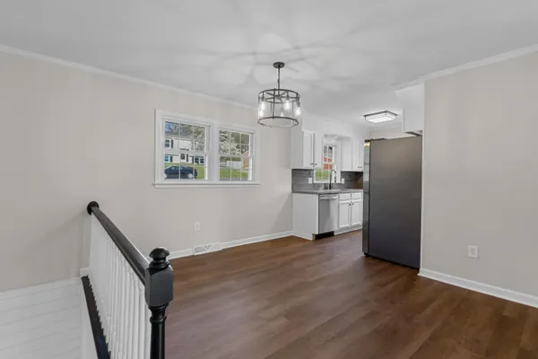 a kitchen with a refrigerator and a sink