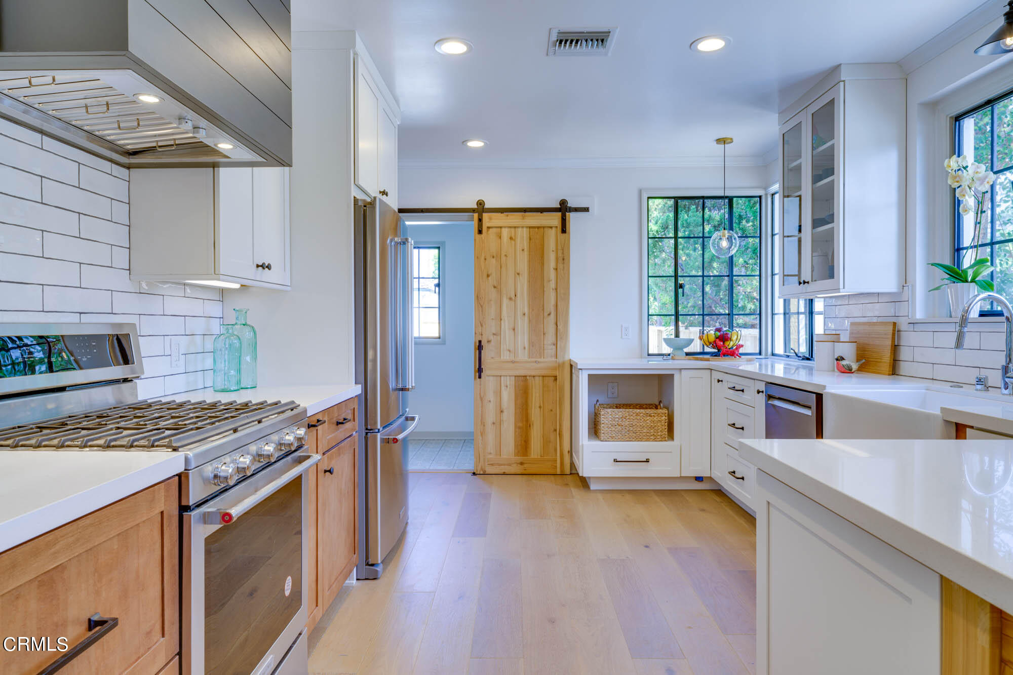 2709 Deodar Circle Pasadena, CA 91107 - Photo 16 of 43 a kitchen that has a lot of cabinets in it and wooden floor