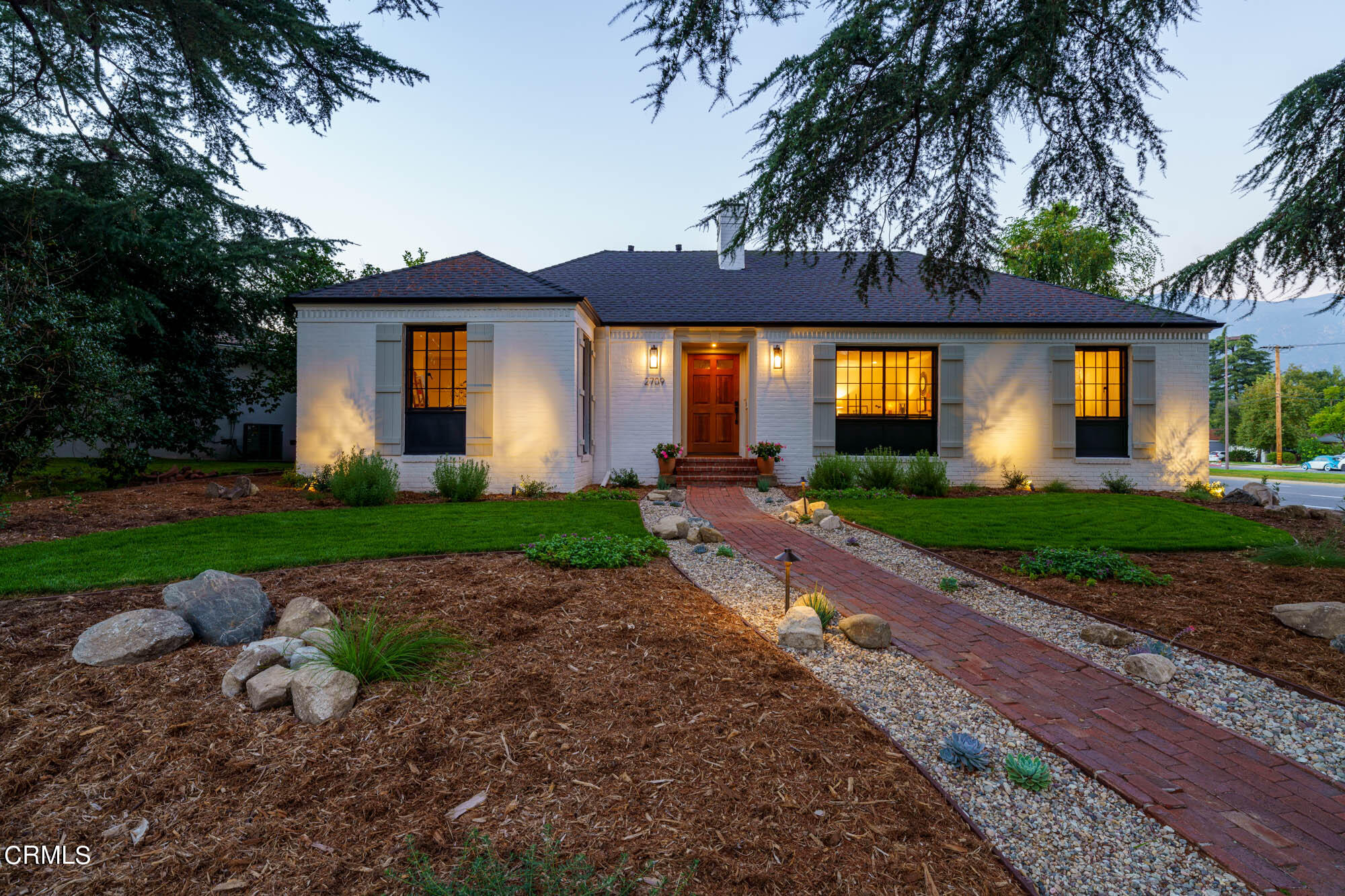2709 Deodar Circle Pasadena, CA 91107 - Photo 2 of 43 a front view of a house with a yard and garage