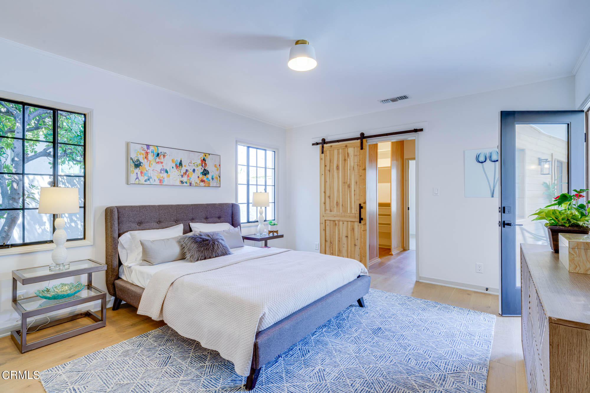 2709 Deodar Circle Pasadena, CA 91107 - Photo 21 of 43 a spacious bedroom with a bed a dresser and a window