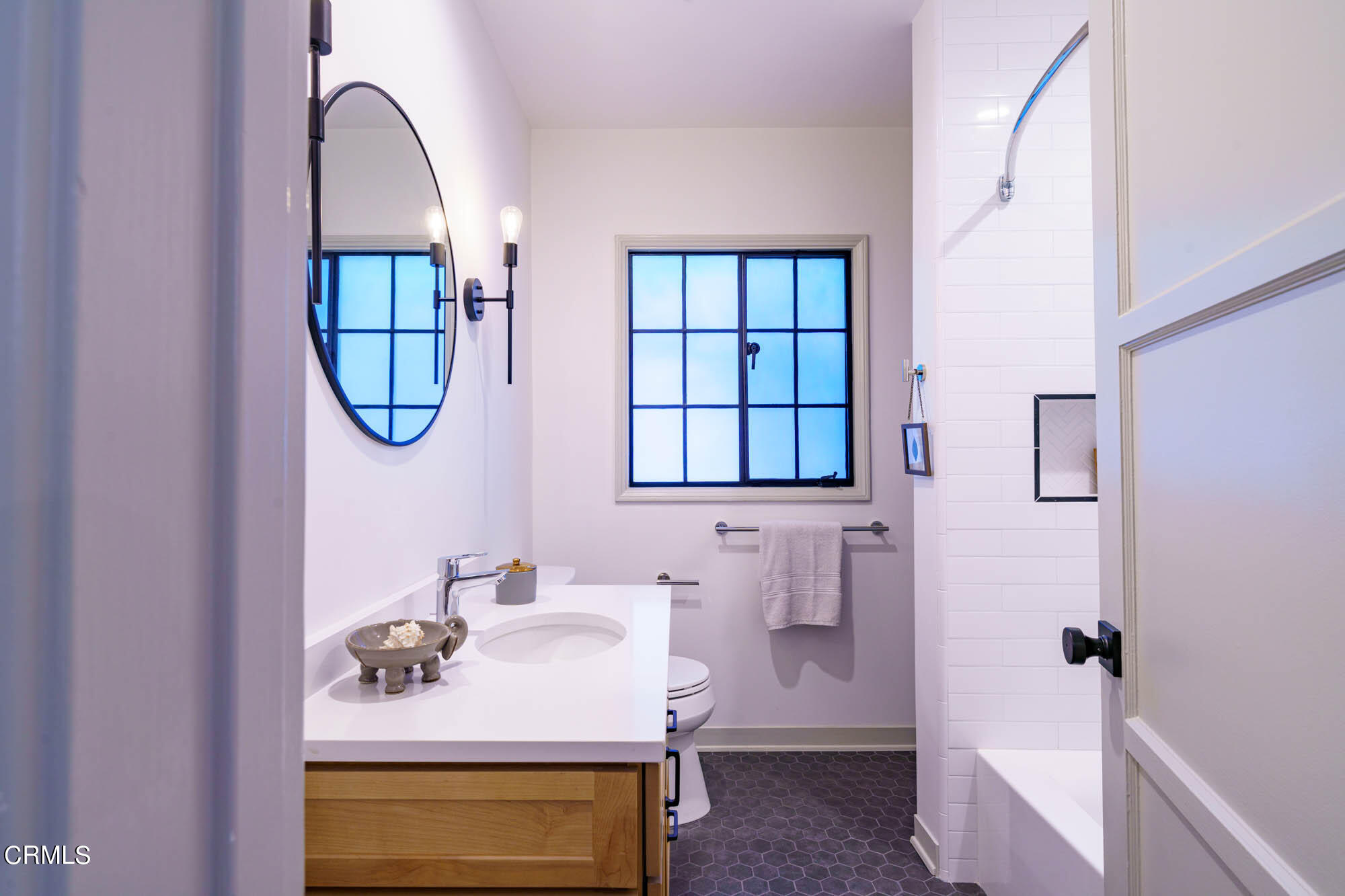 2709 Deodar Circle Pasadena, CA 91107 - Photo 29 of 43 a bathroom with a sink a mirror and a window