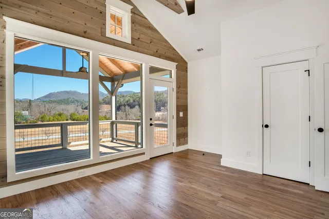 a view of an entryway with wooden floor